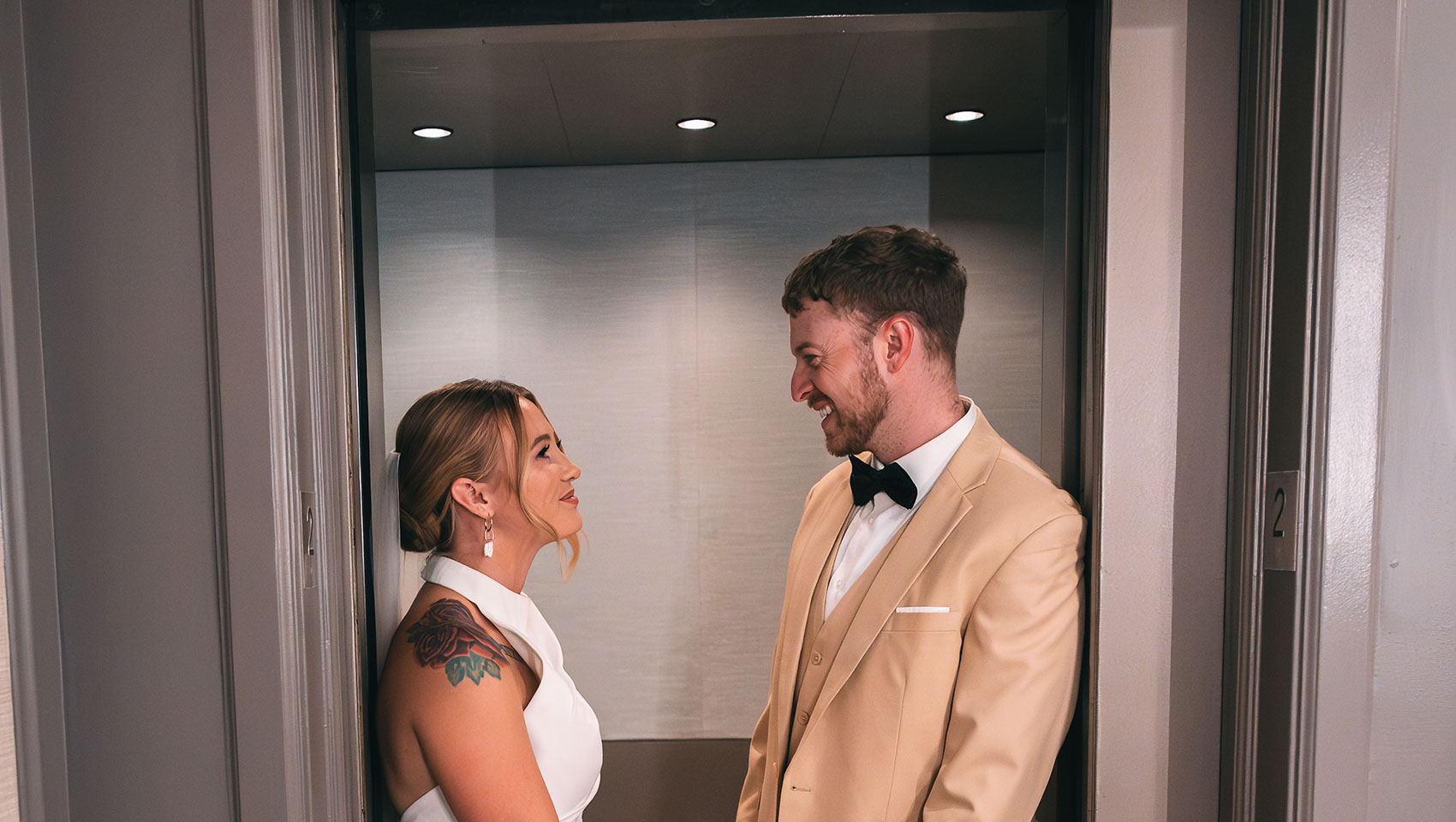 Bride and Groom in front of elevator