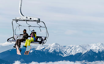 skiers on a chairlift