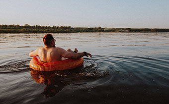 Woman floating in tube